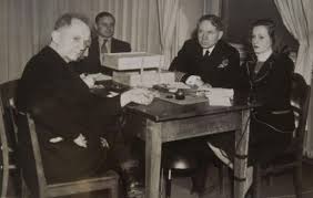 From left, Nuremberg Trials defendant German Navy Grand Admiral Karl Doenitz, unknown translator, Nuremberg trial Judge Michael Musmanno, and court reporter Vivian Spitz