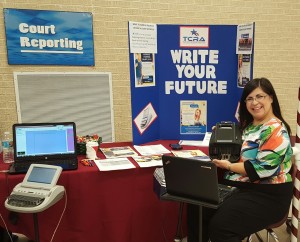 A court reporter shows off her steno machine at a career fair