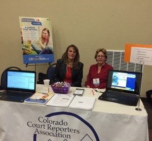 two members of the Colorado Court Reporters Association at their booth at the Colorado school counselors associatio