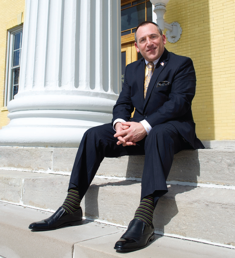 2015-2016 NCRA President Steve Zinone sitting on courthouse steps