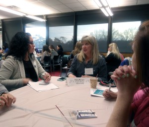 Kelly Moranz, CRI, Tri-C’s court reporting program manager and an adjunct faculty member, talks to attendees during the speed networking session at the Tri-C open house