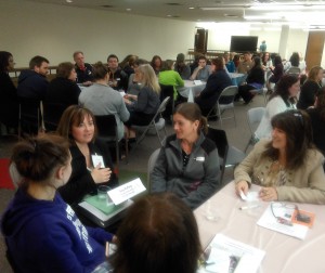 Suzy Rafferty, Tri-C student, talks to attendees during the speed networking session at the Tri-C open house 