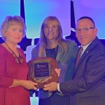 NCRA's Distinguished Service Award was presented to Bill Greenley's wife during the Premier Session