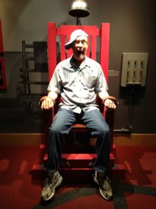 Kevin Daniel in the electric chair at the Mob Museum