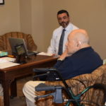 NCRA Board of Director member Steve Clark, a captioner from Washington, D.C., captures the story of U.S. Veteran John Henderson, who served in WWII. Ginger Cove resident Nick Mosunec is the volunteer interviewer.