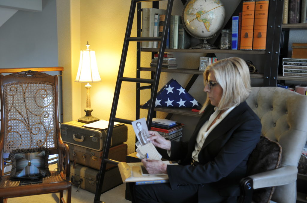 NCRF Chair Early Langley with photo of her uncle, a U.S. veteran who received the Purple Heart