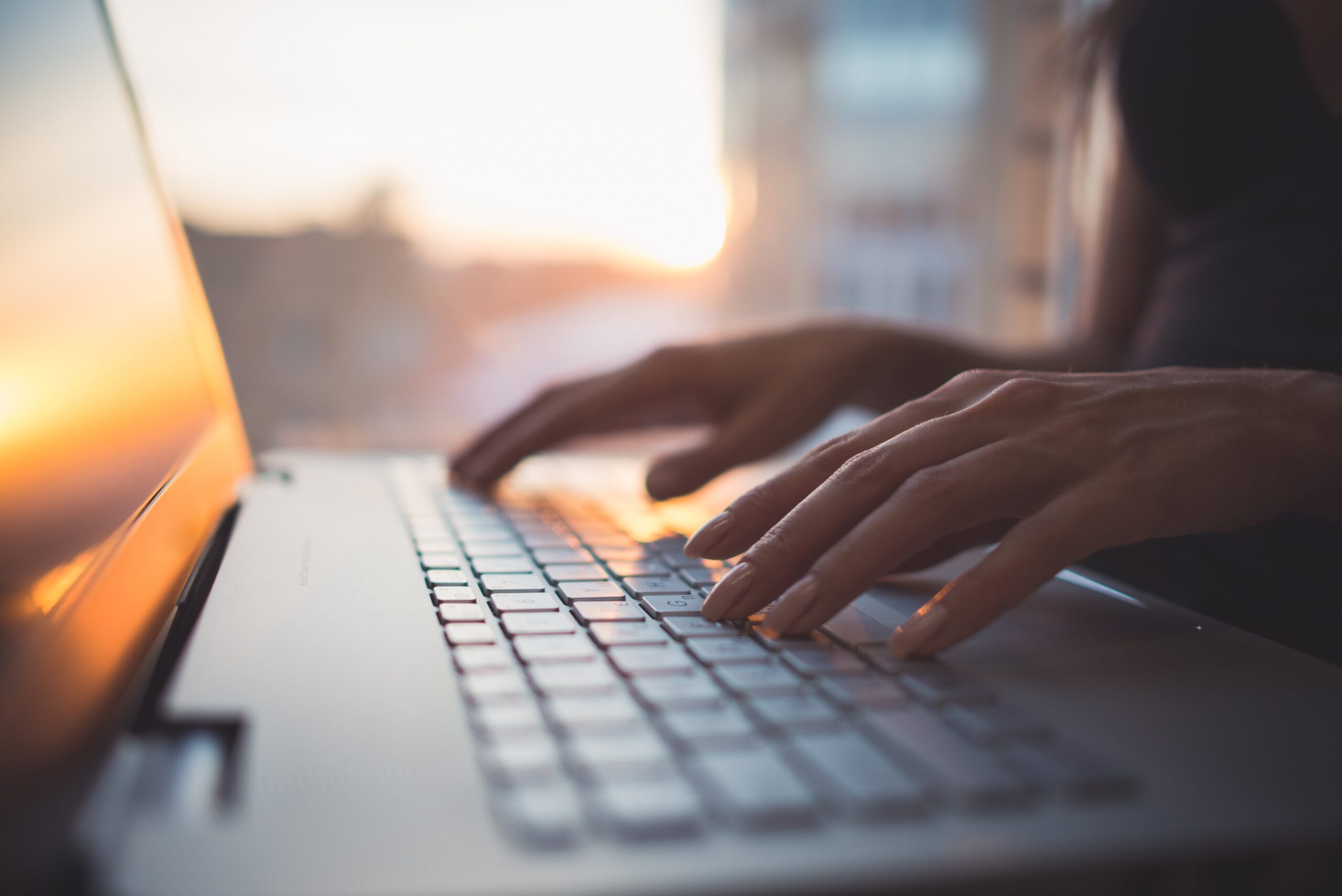 Hands on a laptop