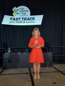 Karen Santucci accepting the CASE Award of Excellence