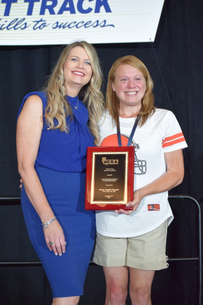 Kristin M. Anderson (l) presents the DSA Award to Sarah E. Nageotte