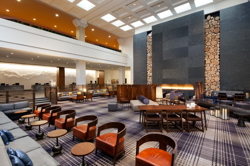 Hotel lobby with chairs and a fireplace