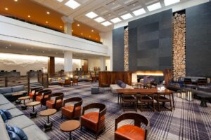 Hotel lobby with chairs and a fireplace