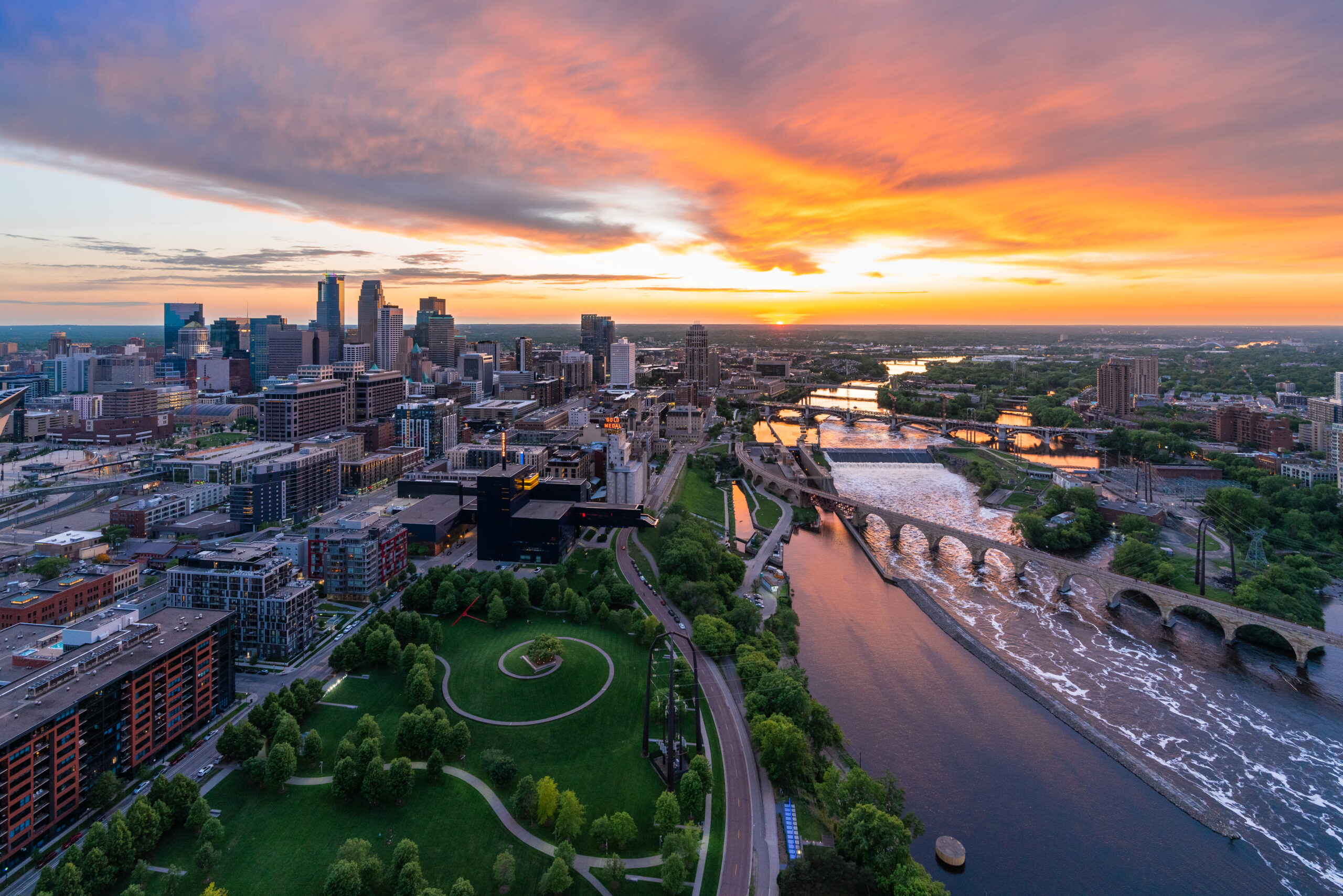 Overhead view of Minneapolis skyline and the Mississippi River at sunset