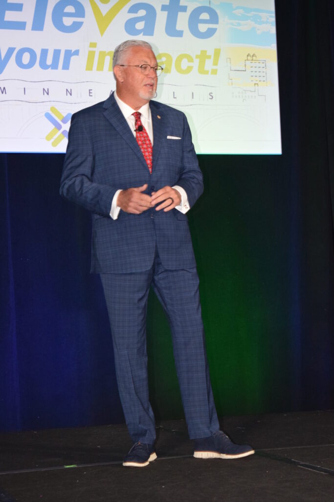 A man on a stage giving a speech