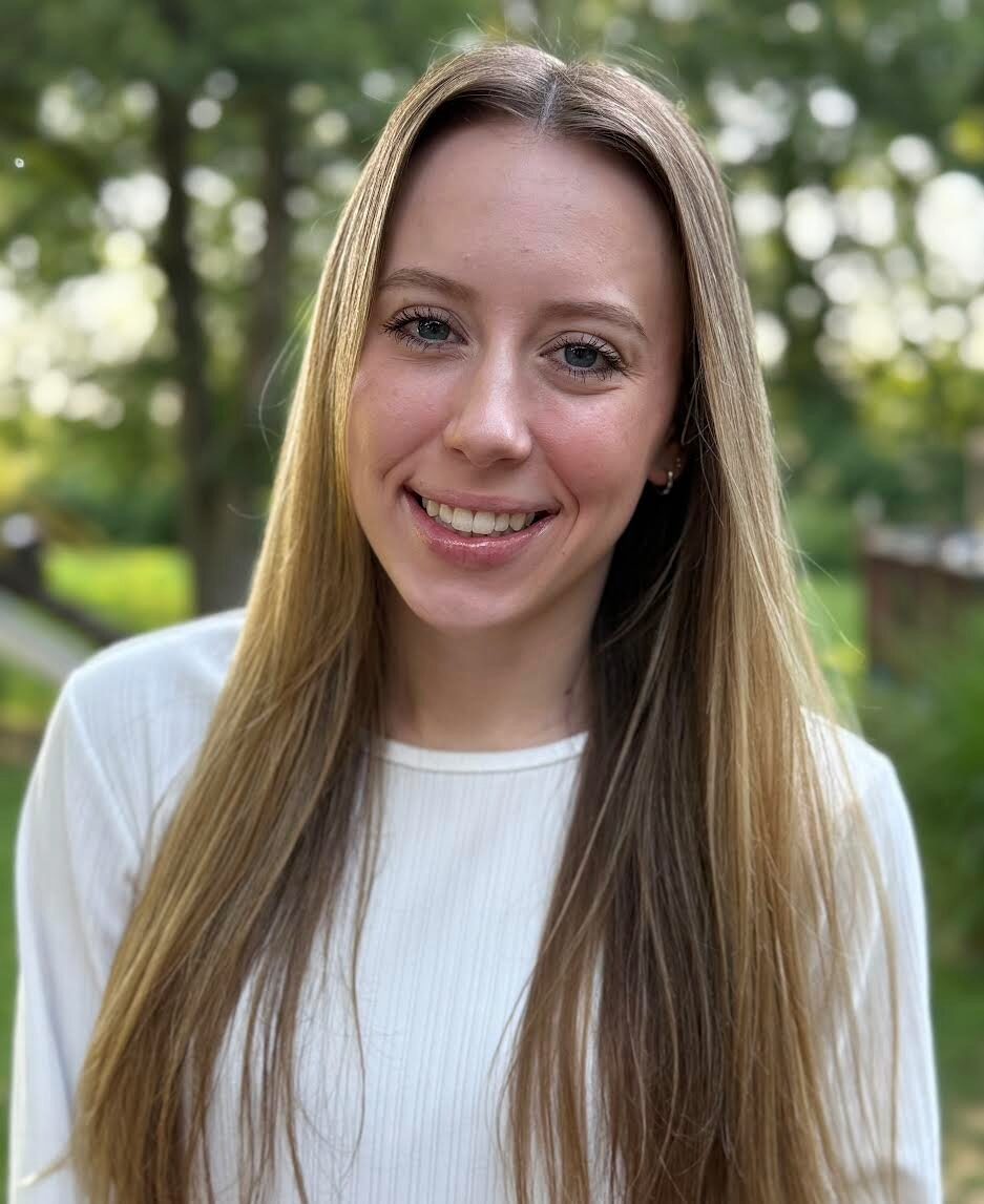 Blonde woman smiling at the camera