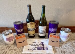 Array of gifts including wine, gift cards, and thermoses