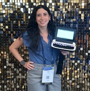 Woman holding a steno machine