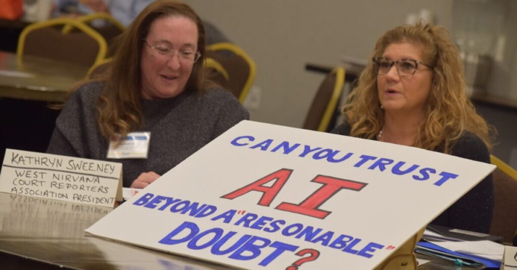 Two women holding a sign