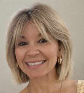 Blonde woman smiling at the camera