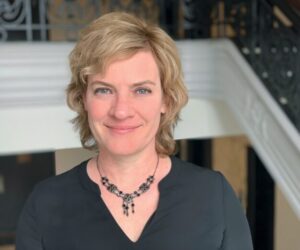 Elle Jovin, keynote speaker for the 2026 NCRA Annual Conference & Expo, smiling in a professional setting.