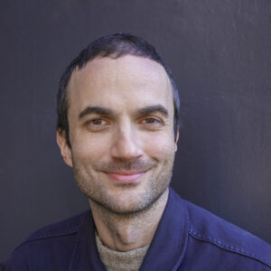 Man smiling at a camera