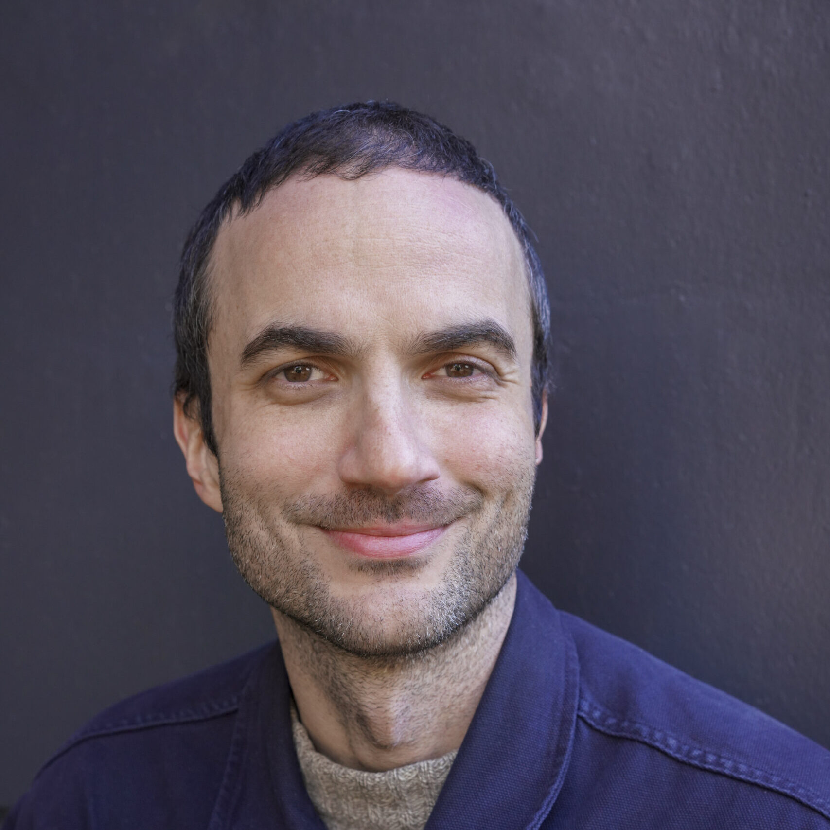 Man smiling at a camera