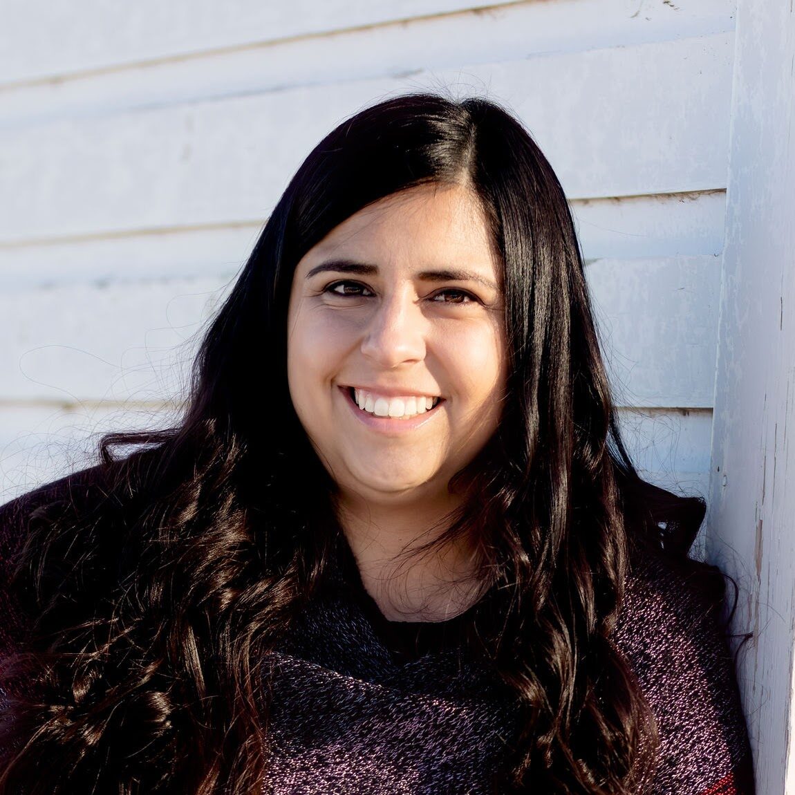 Woman smiling at a camera