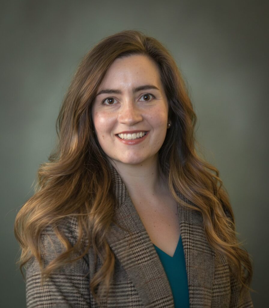 Headshot of a woman with long brown hair