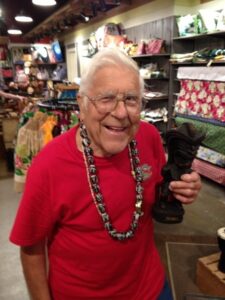 Older man in glasses smiling at the camera