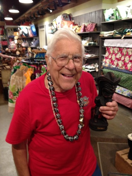 Older man in glasses smiling at the camera