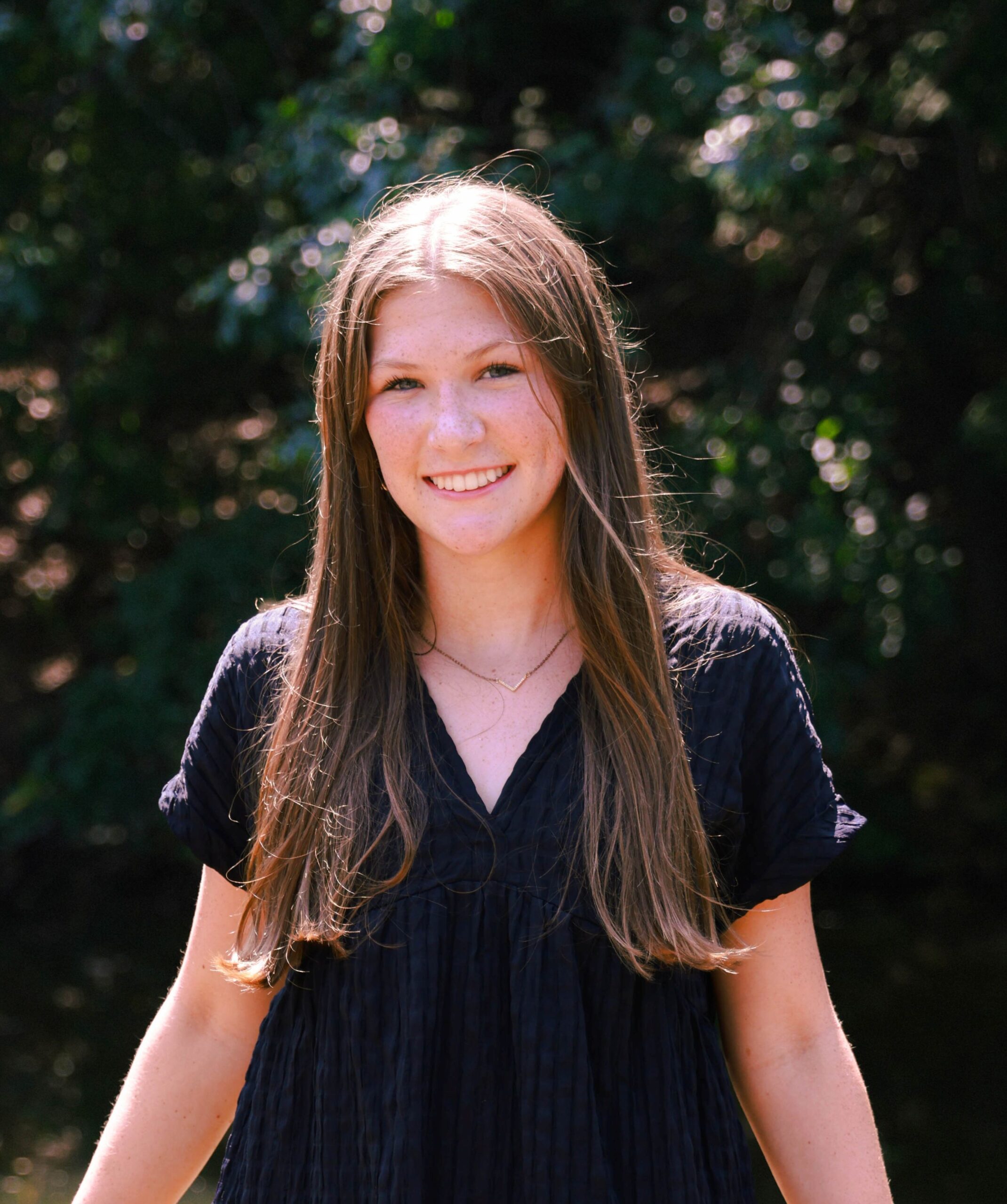 A professional headshot or a woman