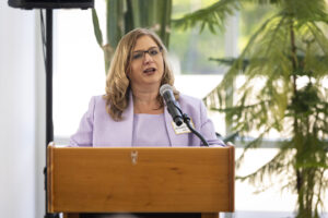 A woman speaking at a podium