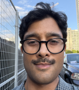 Headshot of male in glasses