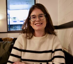 Headshot of a woman in glasses smiling