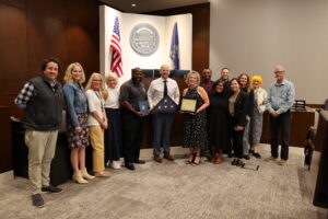 Cindy Isaacsen and Judge Robert J. Wonnell with others in the courtroom